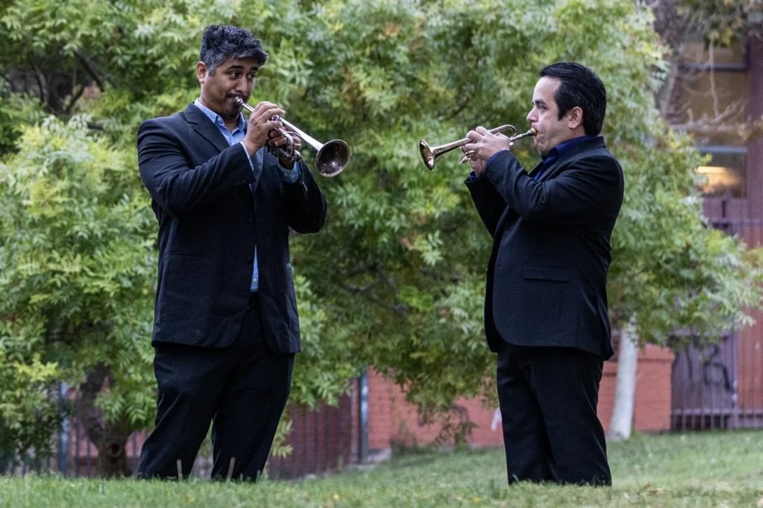 Trumpet players performing outside